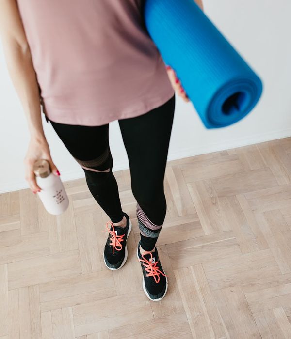 Yoga mat, water bottle, and comfortable clothes ready for practice.